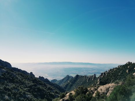 Scenic view of rugged mountains under a clear blue sky, perfect for nature enthusiasts.