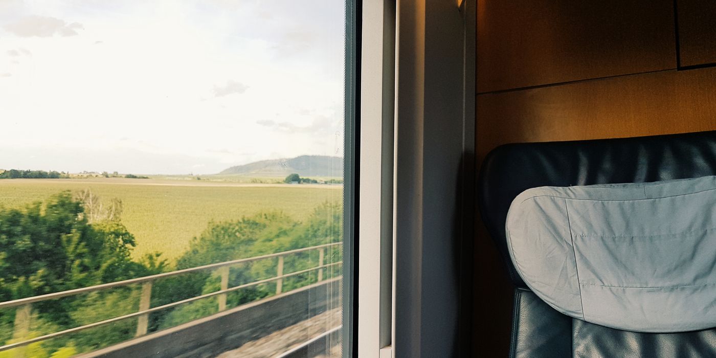 View from a train window on a multi-city summer trip