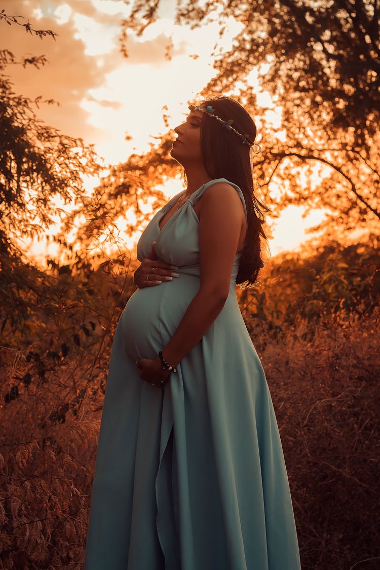 Pregnant Woman Near Tree Branches