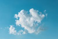 A single cumulus cloud in a blue sky — photo by Gije Cho on Pexels