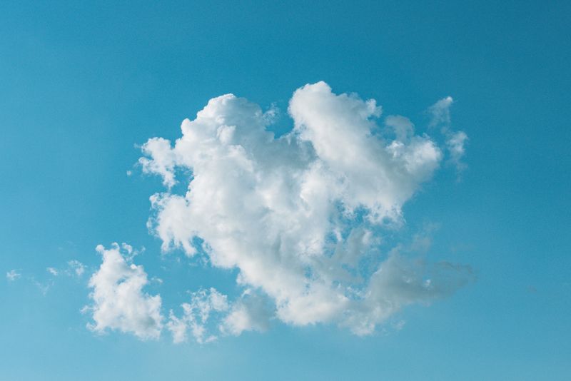 Cumulus clouds over deep blue sky, photo by Gije Cho on Pexels