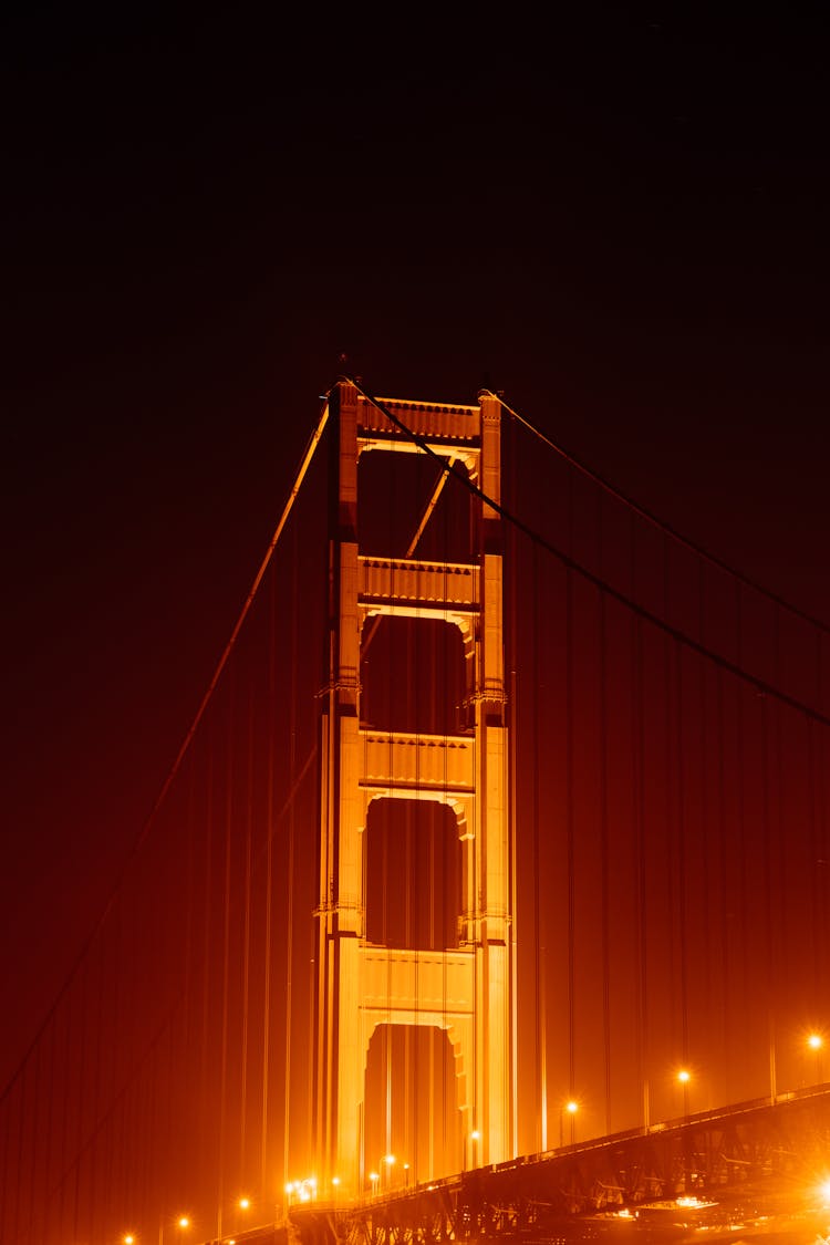 Illuminated Golden Gate Bridge In Fog