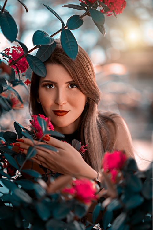 Free Beautiful woman amidst vibrant flowers, showcasing natural beauty and serenity in Brazil. Stock Photo