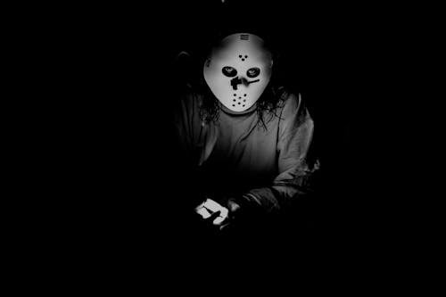 Grayscale Photo of Person Wearing Mask