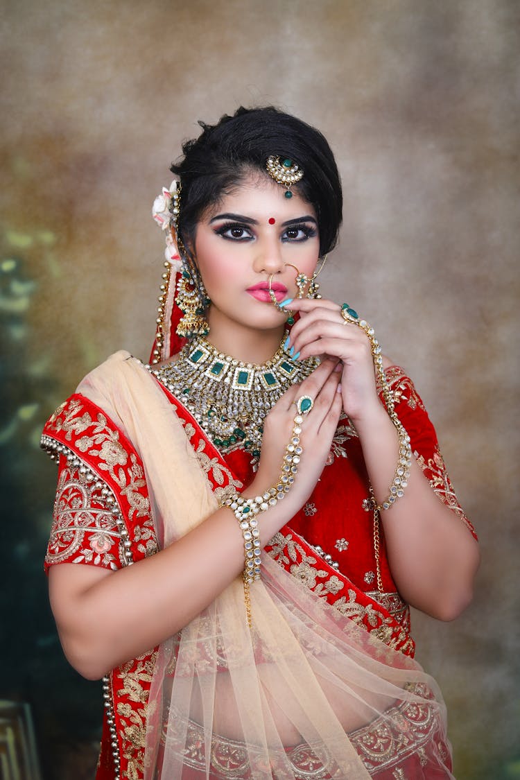 Indian Lady Wearing Traditional Bridal Clothes With Makeup And Jewelries