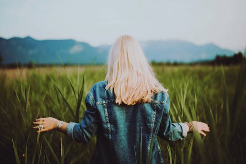 Free Woman Standing on Crop Field Stock Photo