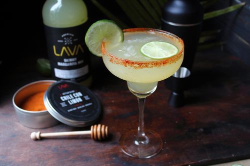 Free Refreshing margarita with lime and chili powder, perfect for a spicy cocktail experience. Stock Photo