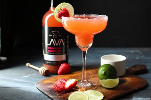 Free Vibrant strawberry lime cocktail with fresh fruit on a rustic board. Stock Photo
