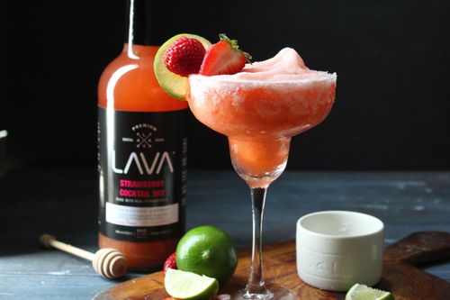 Free Close-up of a strawberry margarita cocktail with lime, made using premium mix. Stock Photo