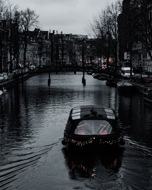 Black Boat on a Water Canal 