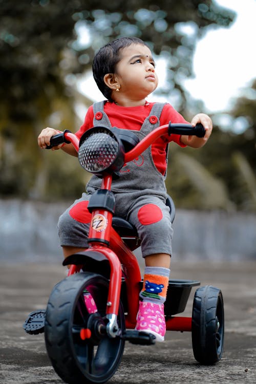 Free Child riding a Bike Toy  Stock Photo