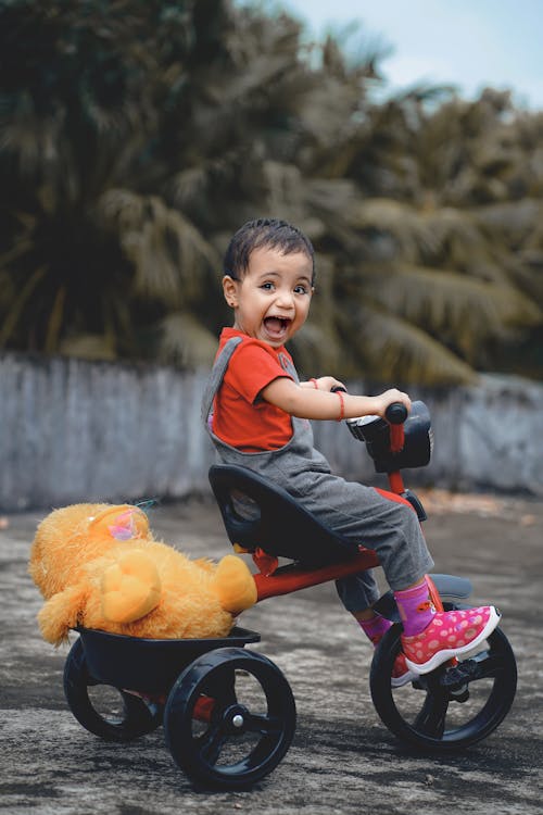 Free A Child riding a Bike Toy  Stock Photo