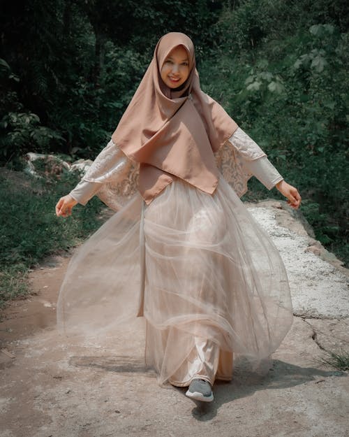Woman in Sheer Dress Wearing Hijab