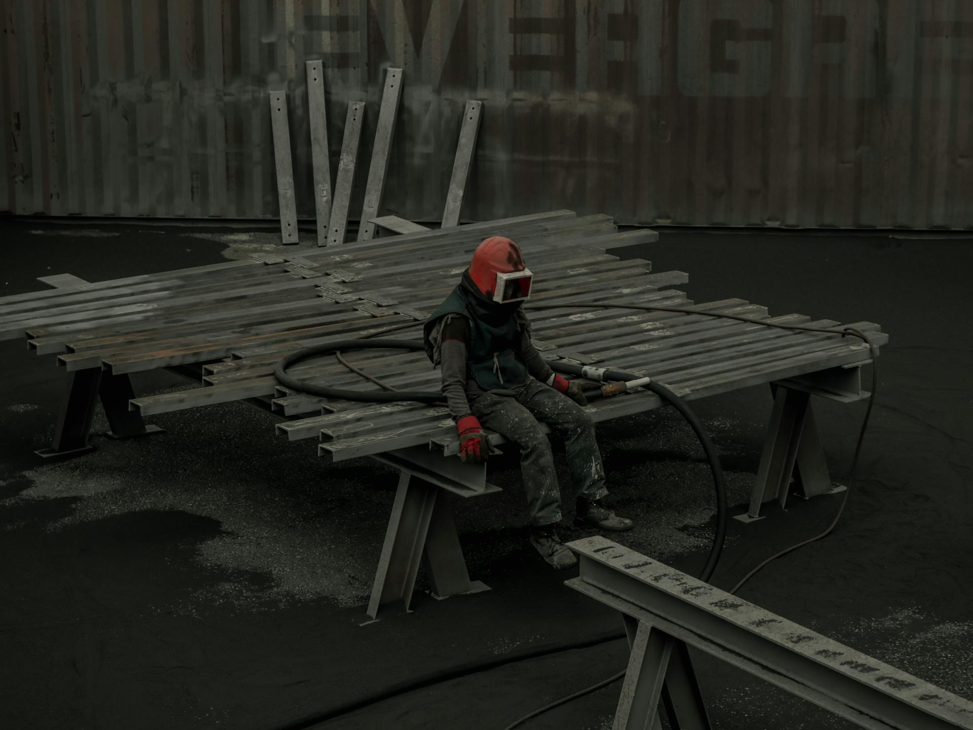 Tired Worker sitting on Steel Beams