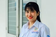 Woman in White Button Up Shirt Smiling Beautifully
