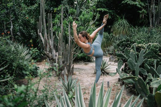 A woman performing a yoga pose in a verdant desert garden, surrounded by cacti and greenery.