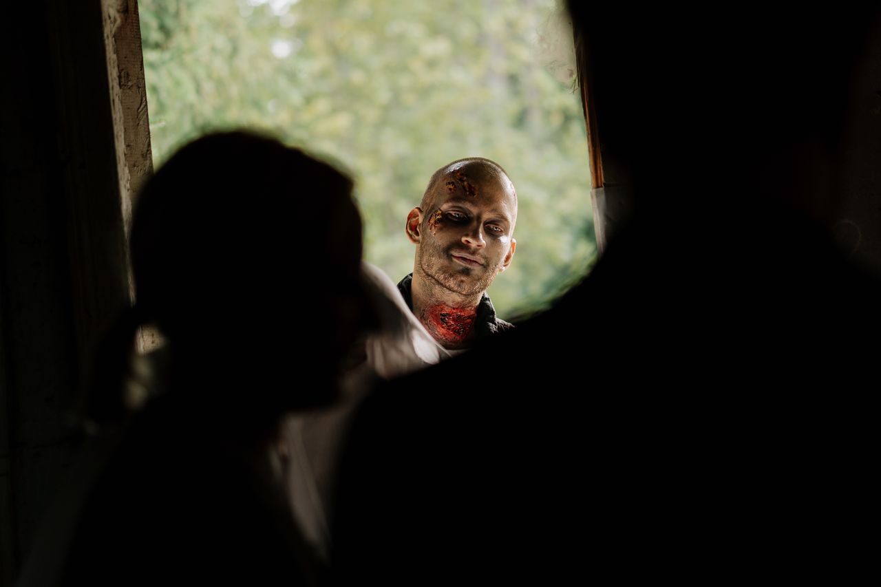 a chilling scene with a zombie peering through a doorway perfect for h