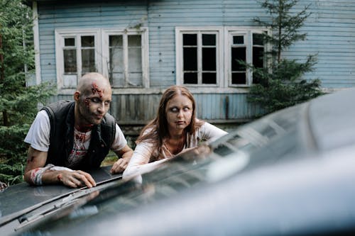 Free Two Zombies leaning on a Car  Stock Photo