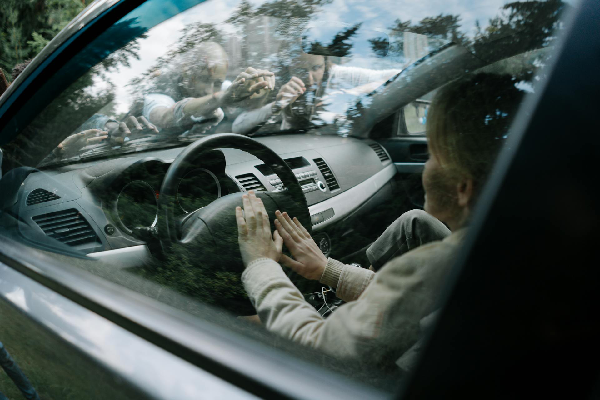 Person inside a Car being attacked by Zombies