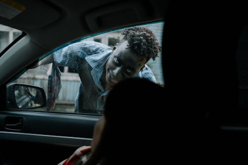 Free Zombie peeking through a Car  Stock Photo