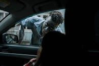 Zombie peeking through a Car
