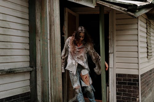 Woman Zombie coming out from a House 