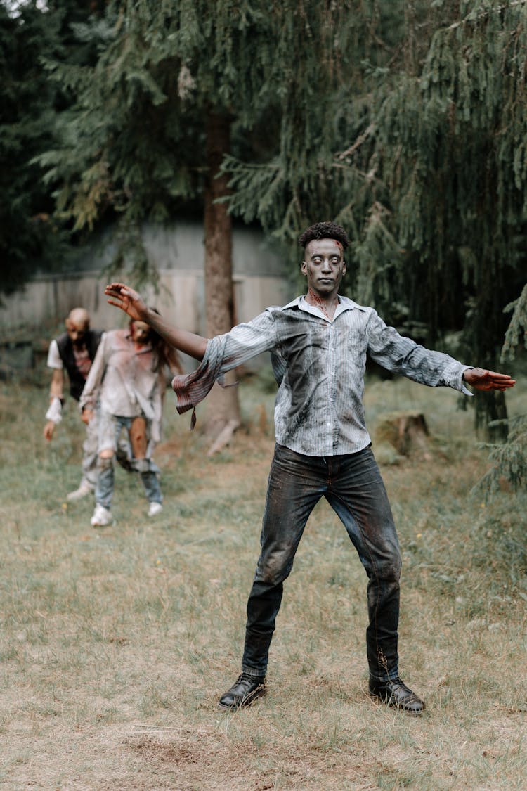 Zombie Characters Walking On A Grass Field