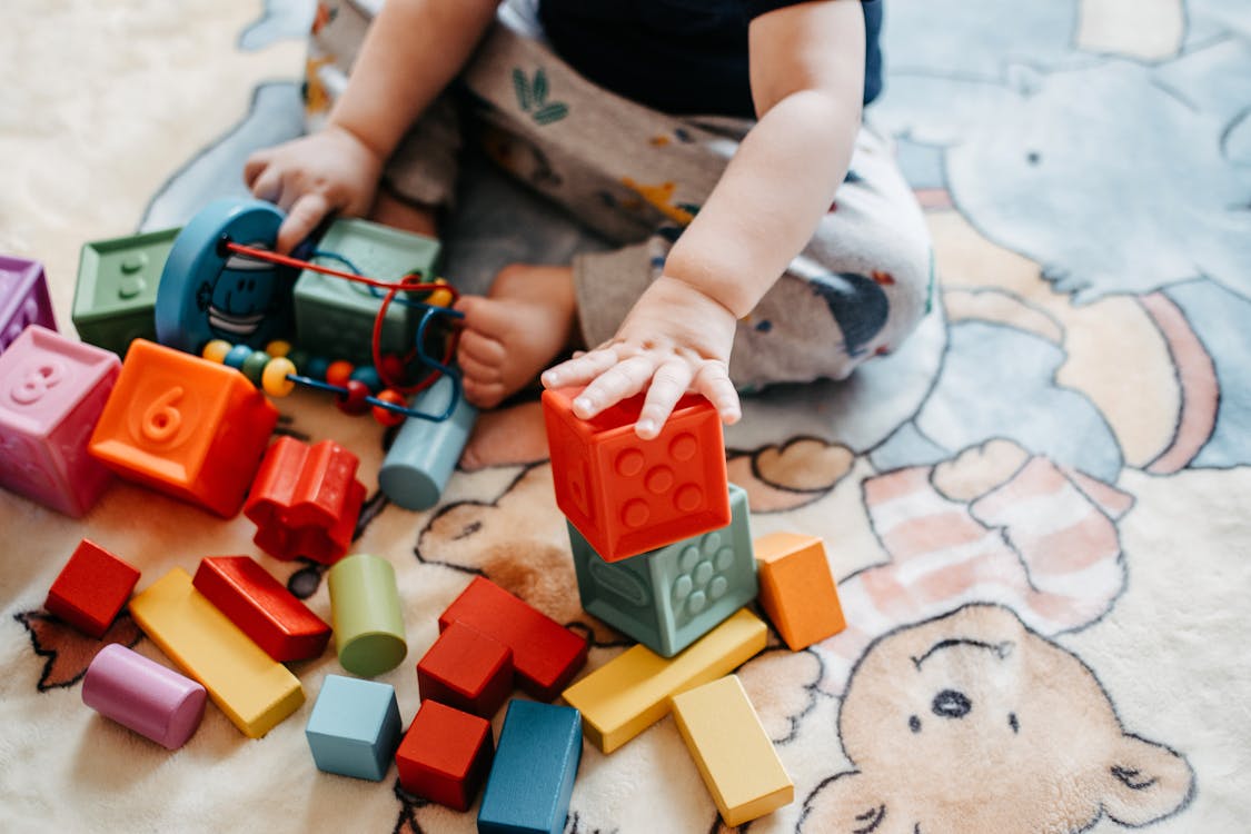 Child Playing With Lego Blocks