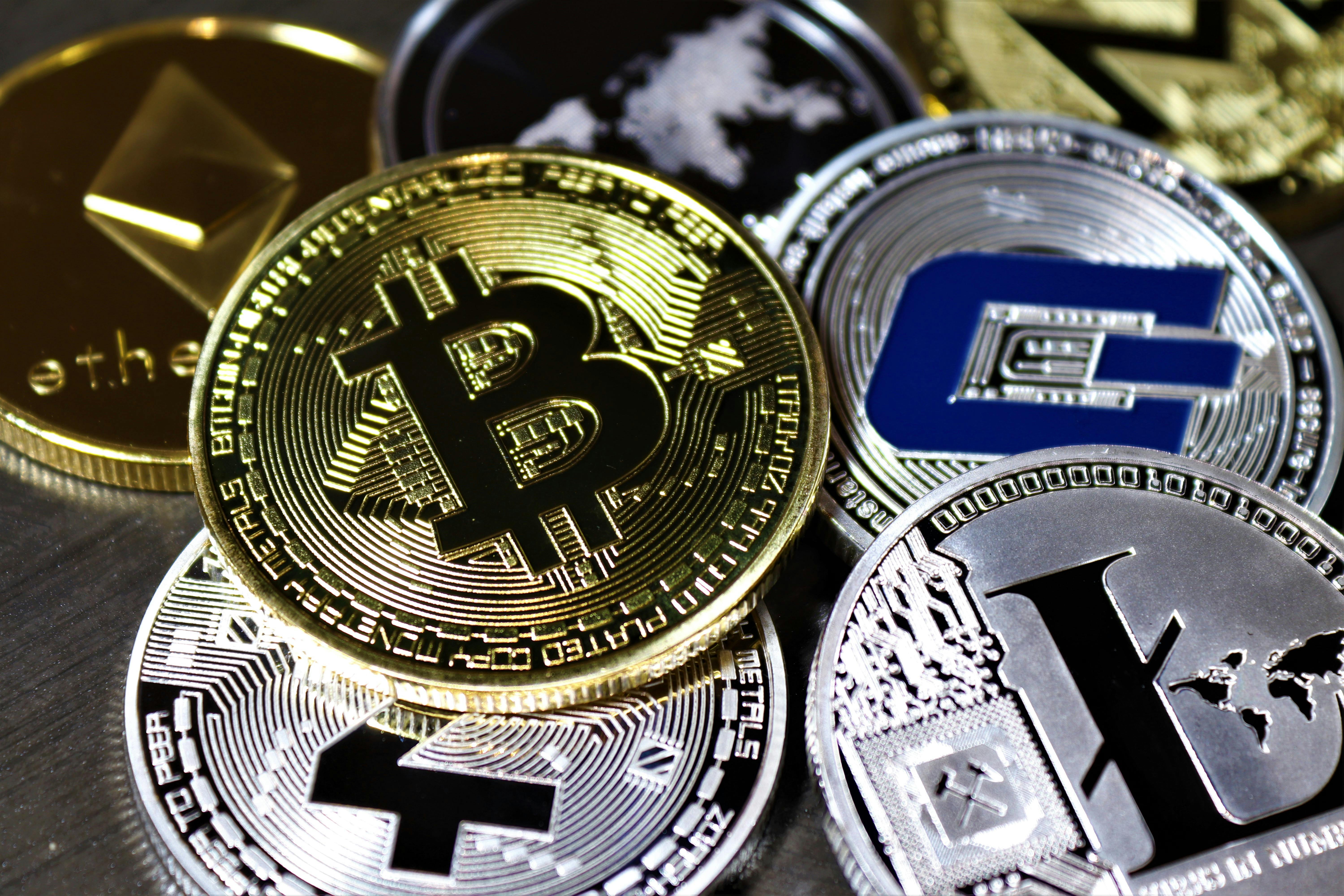 Various Cryptocurrency on Table · Free Stock Photo