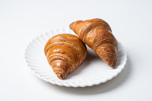 Free Croissant Bread on a Ceramic Plate  Stock Photo