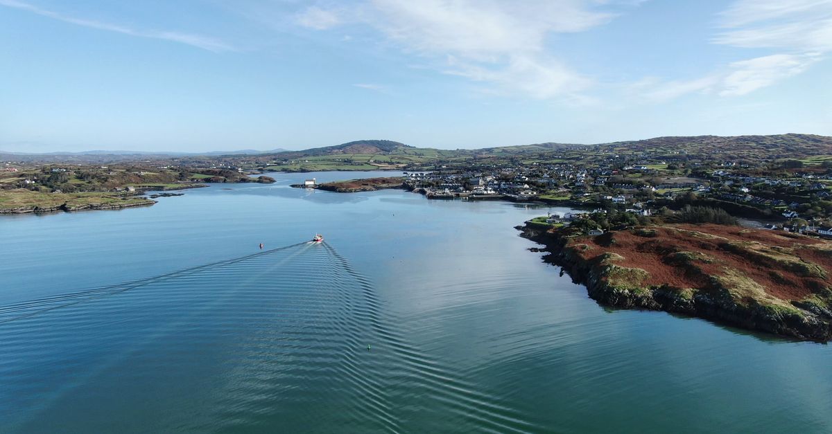 A breathtaking aerial view of Baltimore Harbor in County Cork, showcasing serene waters and picturesque landscapes.