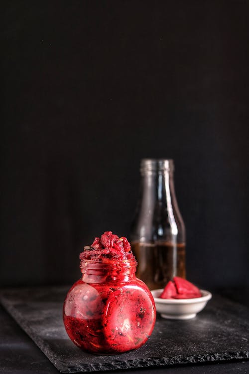 Red Round Fruit on Brown Wooden Table