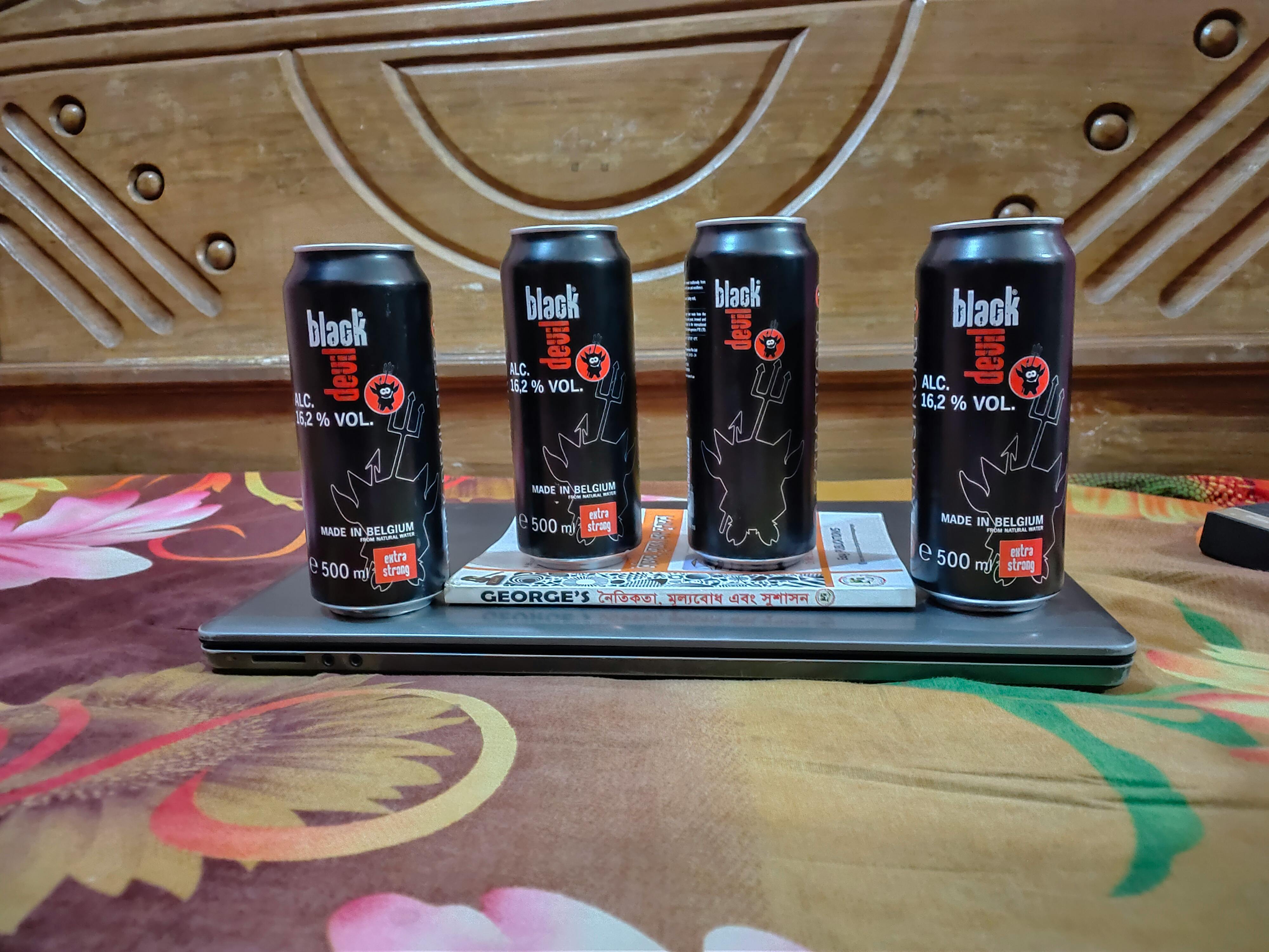 A small dog sitting on a couch in an apartment