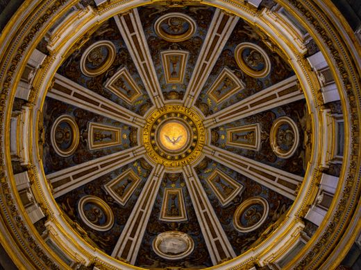 Detailed view of the ornate ceiling inside St. Peter's Basilica Dome, Vatican City.