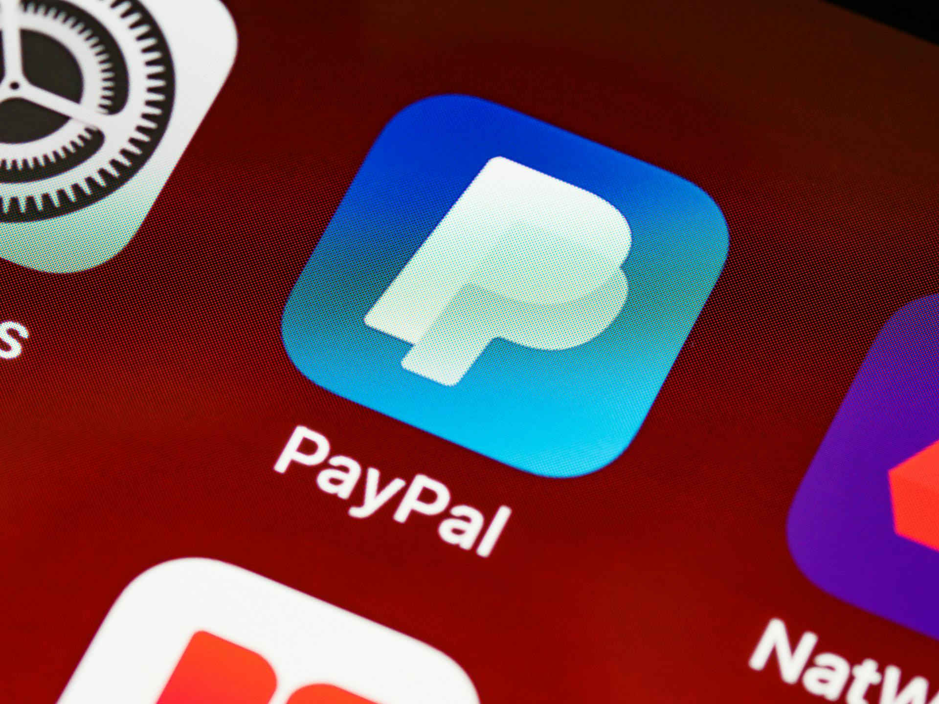 Detailed view of PayPal app icon on a smartphone screen highlighting mobile payment technology.