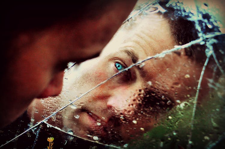 Blue Eyed Man Staring At The Mirror