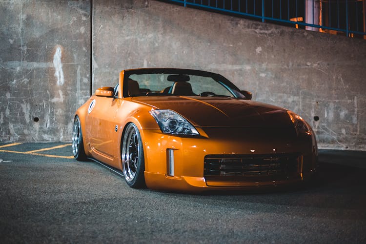 Modern Racing Car In Public Parking At Night