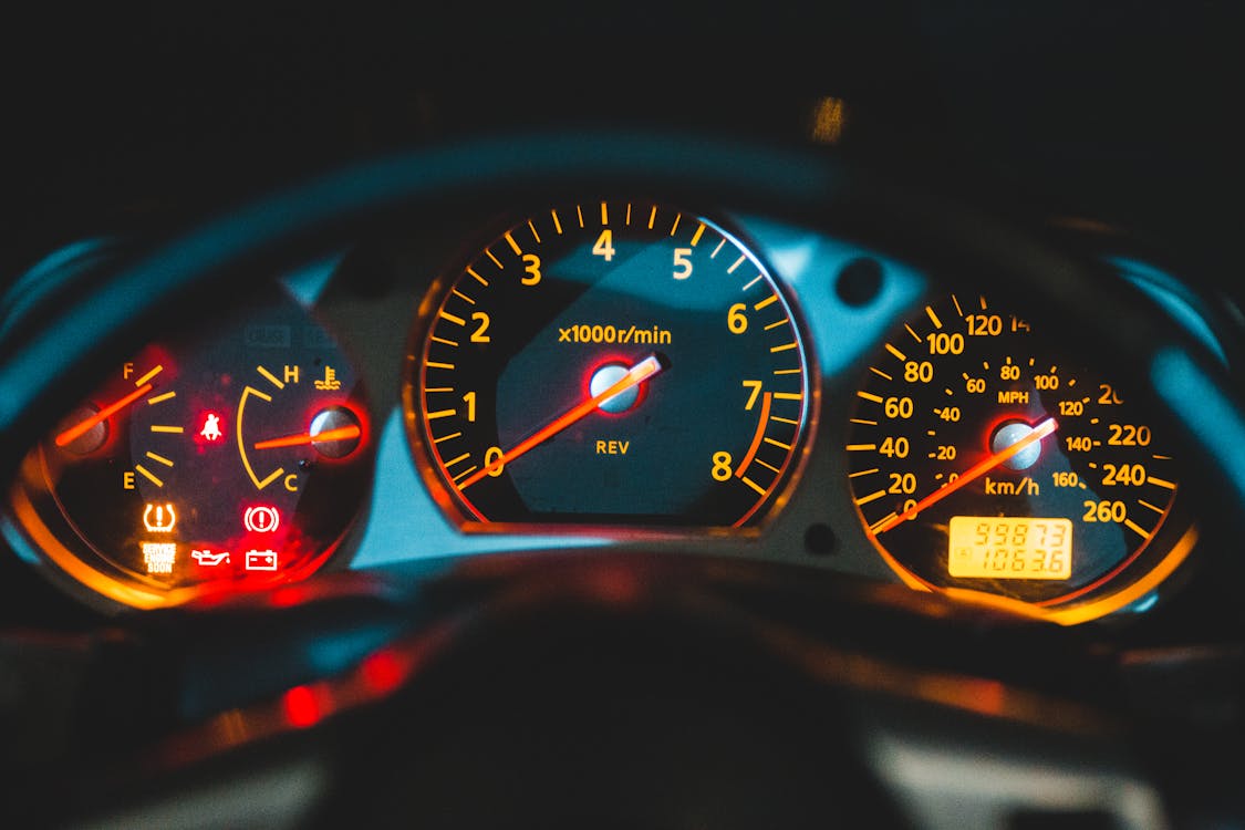 Free Closeup of tachometer near speedometer and oil pressure gauge on colorful dashboard in modern car Stock Photo