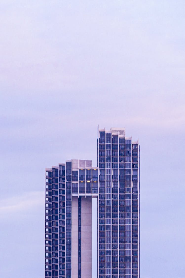 Modern Skyscraper Against Cloudy Sky