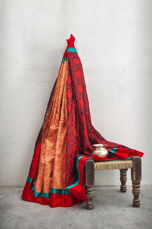 Red Textile on Brown Wooden Armchair