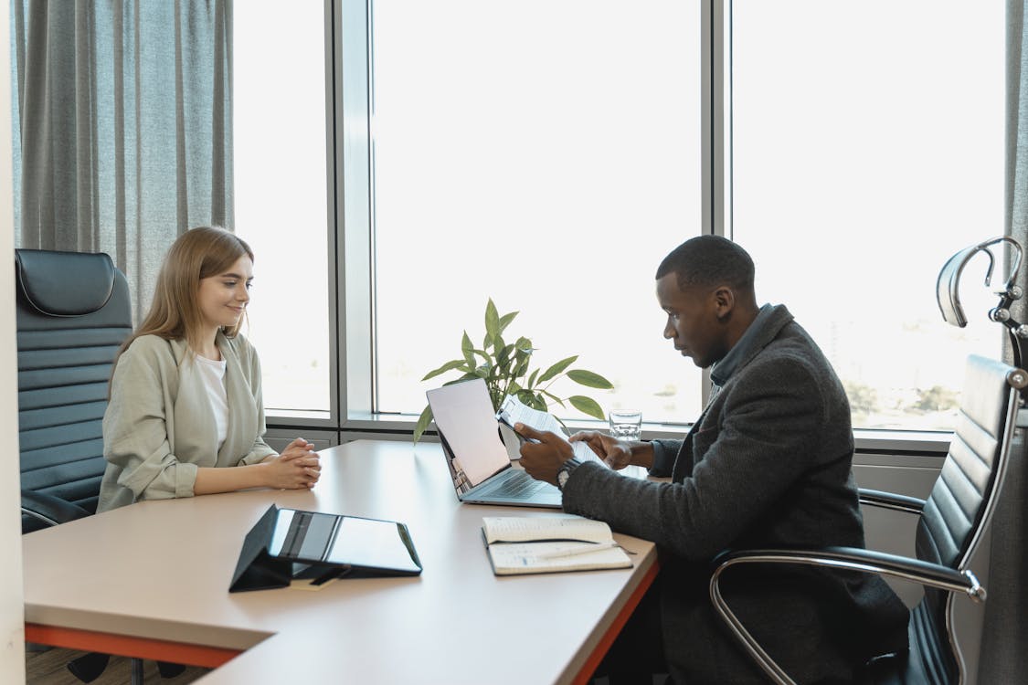 Money Lender Next to a Client