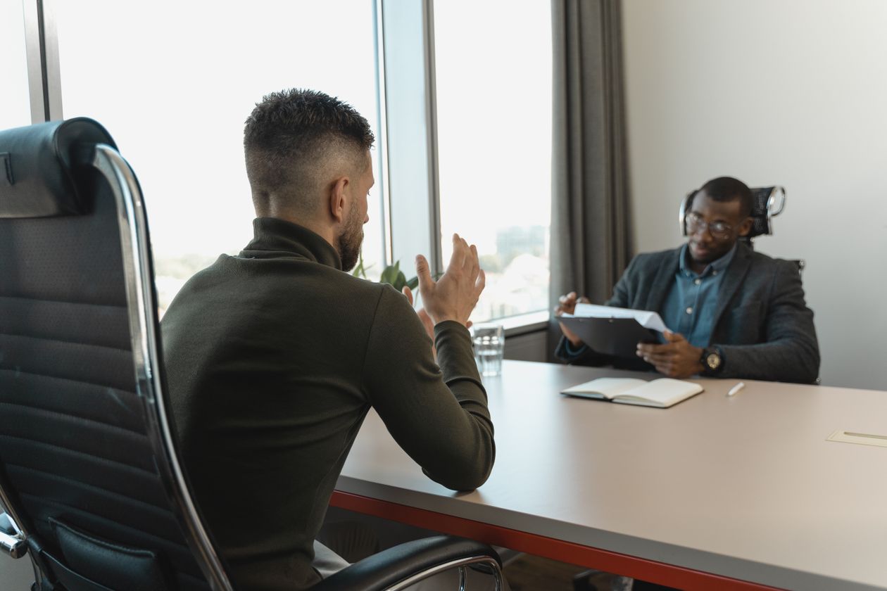 Two men in a job interview in a modern office