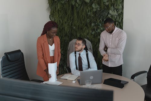 Free People Working Together in an Office Stock Photo