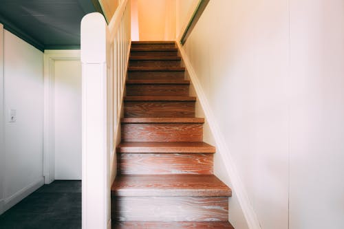 Free Brown Wooden Staircase With White Wall Stock Photo