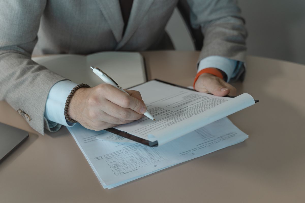 Hand signing on paper