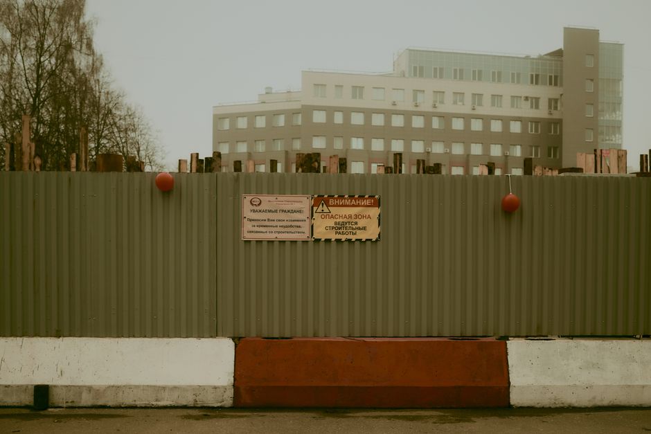 modern office building construction site with safety barriers