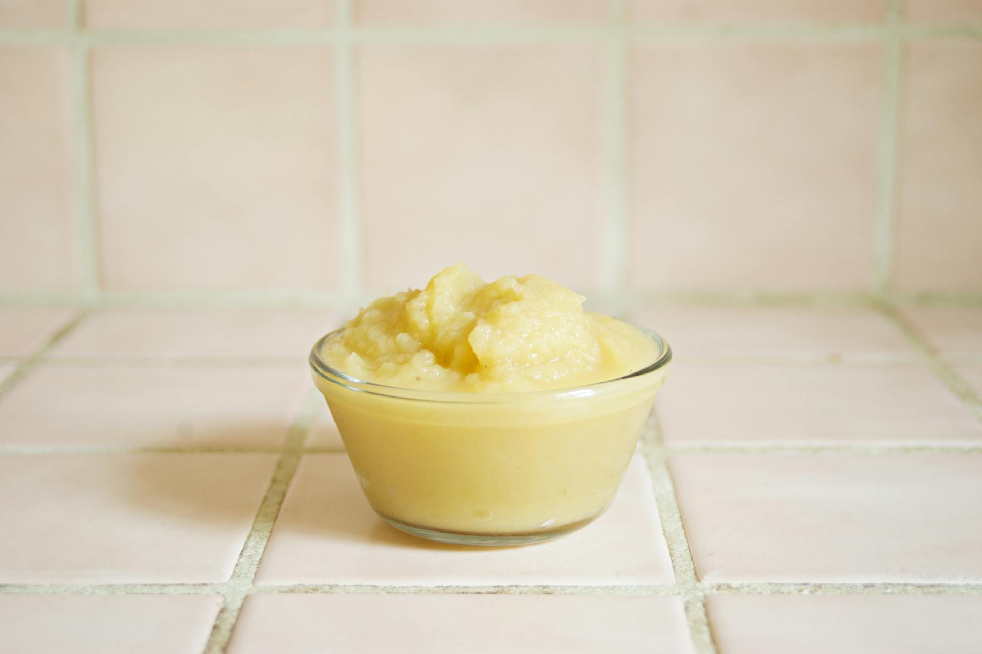 Yellow Baby Food in Ceramic Bowl