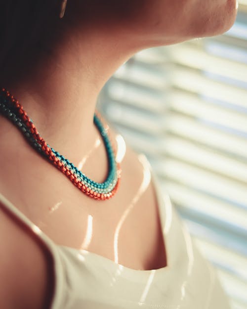 Layers of Necklaces on Woman's Neck
