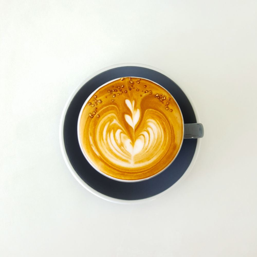 Oat milk latte with latte art