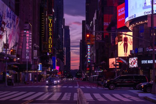 Capture the lively cityscape of Times Square, New York at twilight with glowing neon lights and bustling streets.